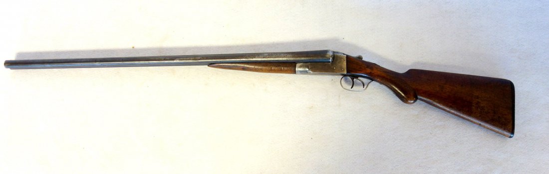 Ithaca double barrel hammerless 12 gauge shotgun -: Ithaca double barrel hammerless 12 gauge shotgun - signed Ithaca Gun Company, Ithaca NY - slight surface rust, otherwise very good working condition. Please note: All of our firearms are sold from pri