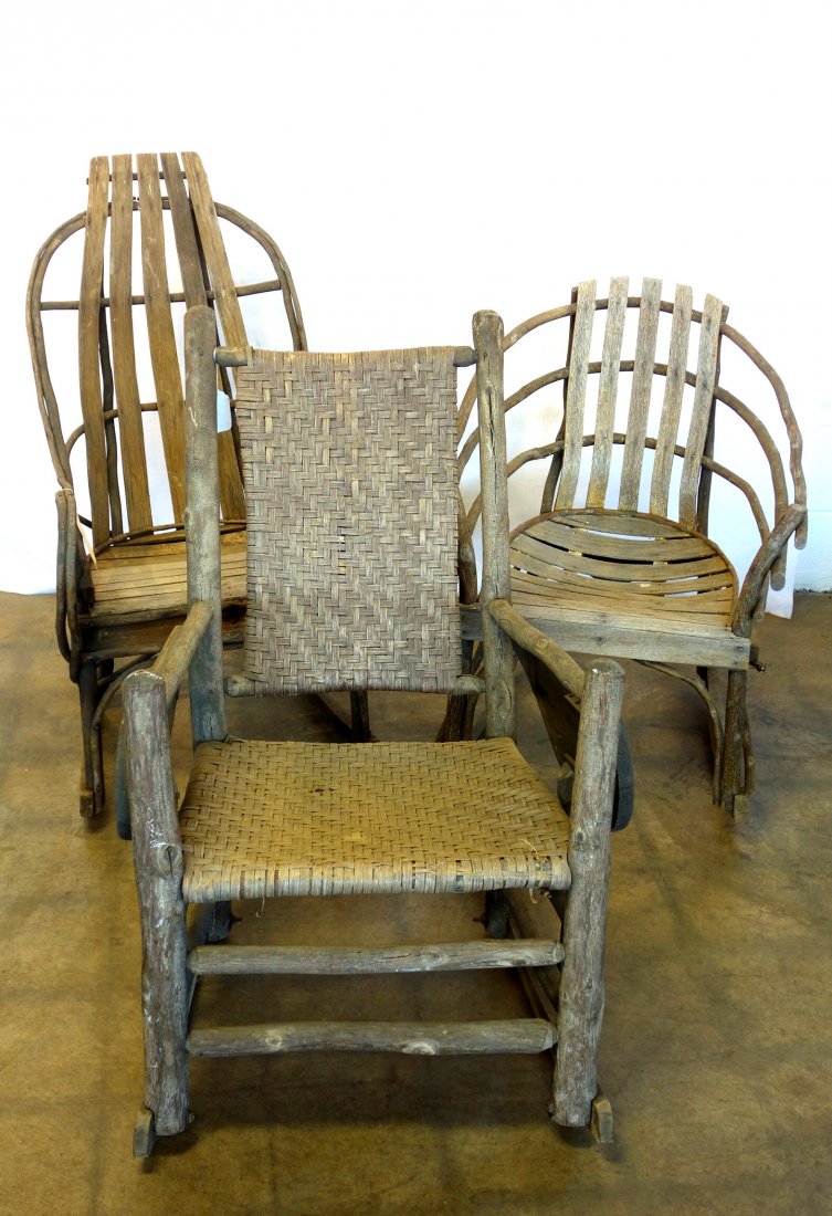 Three rustic Adirondack style twig rockers including: Three rustic Adirondack style twig rockers including signed Old Hickory with removable arm rest extensions, and 2 slat back twig rockers, possibly Amish. Late 19th to early 20th century. Some wear and