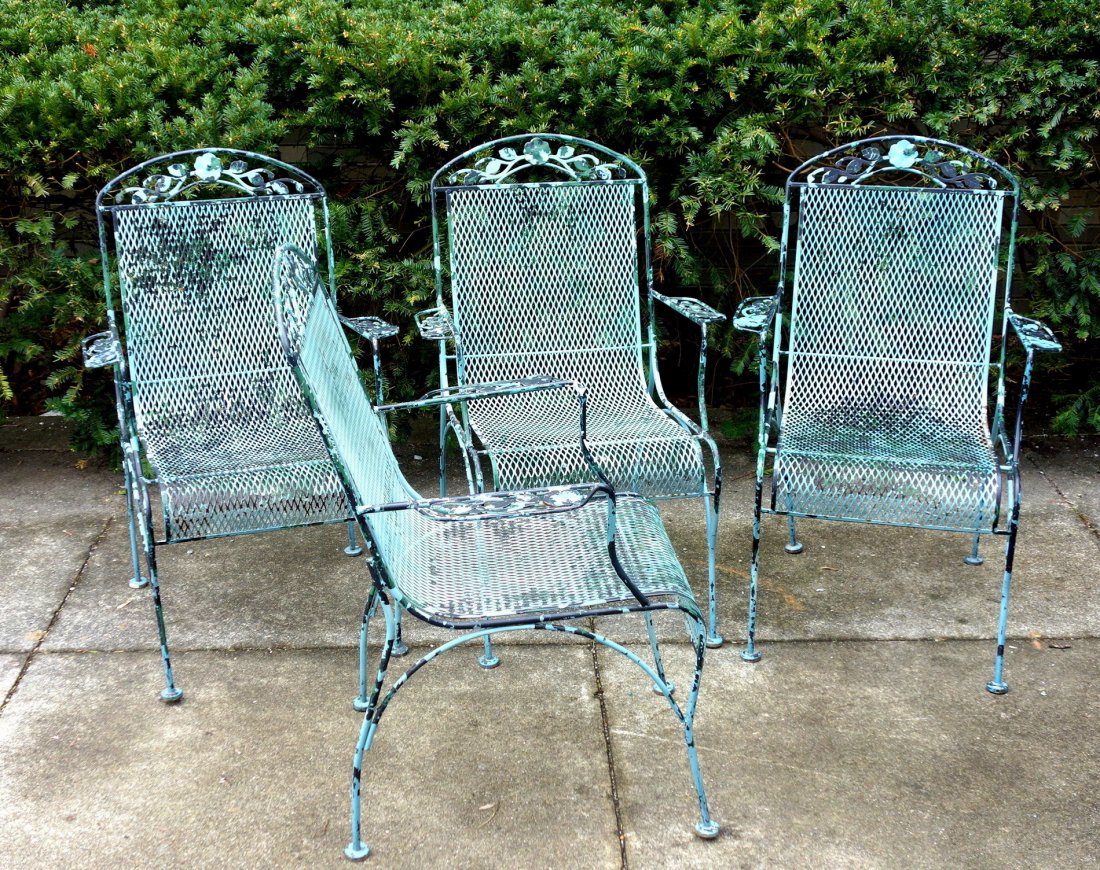 Set of 4 old iron lawn chairs with rolled wire mesh: Set of 4 old iron lawn chairs with rolled wire mesh seats and back in old paint with floral crest - circa 1960-70. All in very good structural condition.