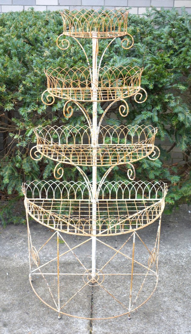 Victorian wire planter with 4 graduated tiers in old: Victorian wire planter with 4 graduated tiers in old white paint. 62.5"H x 30.5"W x 15.5"D. Very good structural condition.