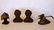 Three cast iron decorative objects including Abe