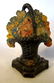 Three cast iron decorative objects including Abe - 2