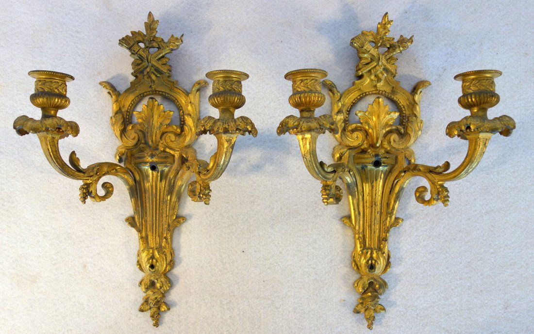 Pair of French style 2 arm brass wall sconces with gold: Pair of French style 2 arm brass wall sconces with gold finish, late 19th to early 20th century - 13"H x 9"W. Very good condition.