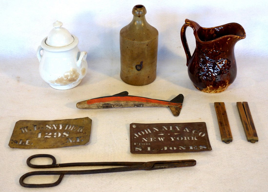 Grouping of country items including carved wooden fish: Grouping of country items including carved wooden fish decoy in original paint, 2 folding rules, 2 copper stencils, ironstone sugar bowl, Bennington pitcher, stoneware bottle and 18th century hand for