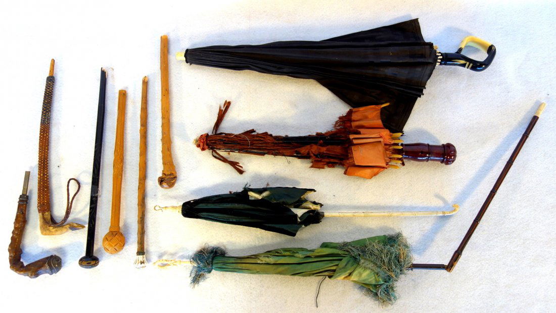 Grouping of old umbrellas & parasols and 6 handles.: Grouping of old umbrellas & parasols and 6 handles. Includes 2 deco umbrellas with plastic handles - damaged tops, two 19th century parasols with carved bone handles also with damaged tops, and 6 most