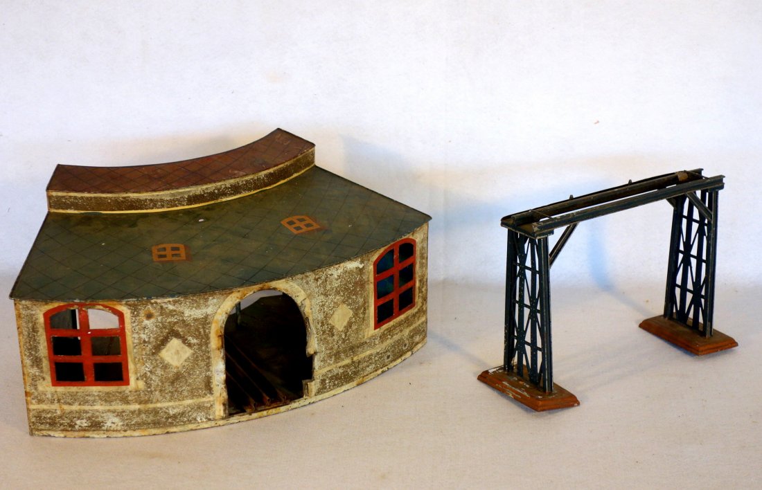 Two signed Marklin railroad accessories including: Two signed Marklin railroad accessories including trestle in original paint - 11.25"L - some paint chips, good structural condition; together with a tin round house in original paint - some paint loss