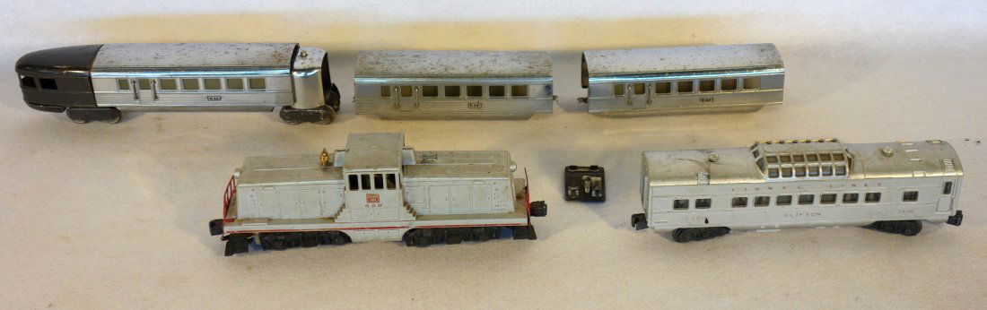 Grouping of trains including Lionel Burlington Route: Grouping of trains including Lionel Burlington Route 629 engine and Clifton 2432 passenger car; together with 3 piece Bullet car 2- 617 & 618 - one coupler missing, otherwise good condition.