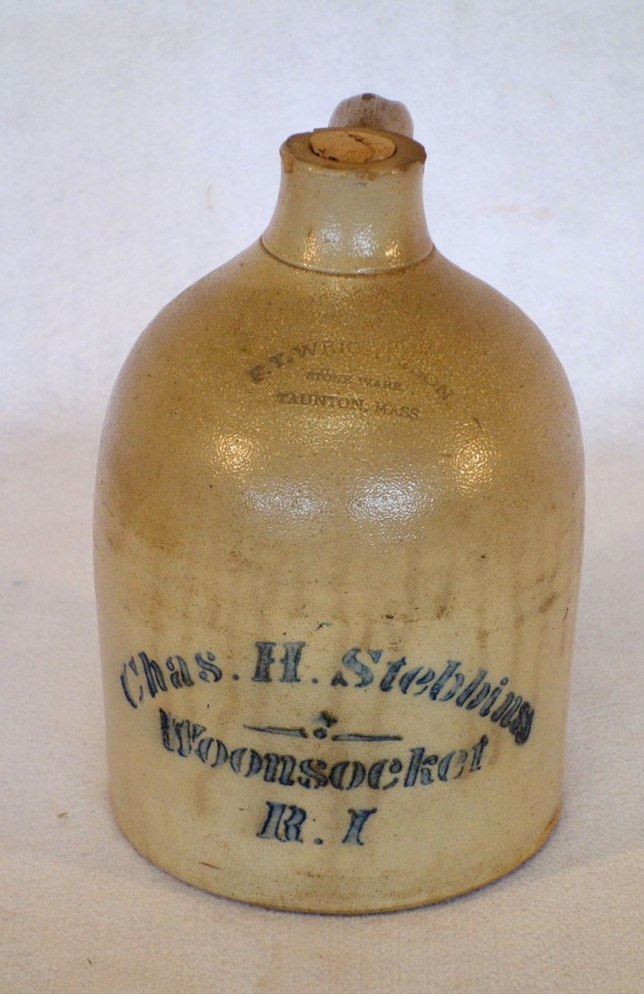 Stoneware 1 gallon store advertising jug with stenciled (1 of 4)