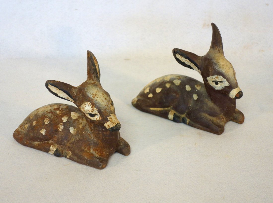 Two cast iron reclining deer. 8"L, Good condition.: Two cast iron reclining deer. 8"L, Good condition.