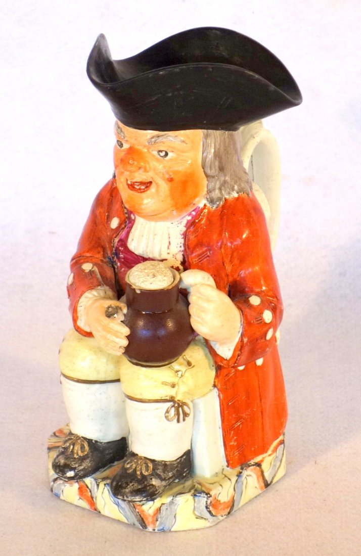 Early Staffordshire toby jug depicting a seating (1 of 4)