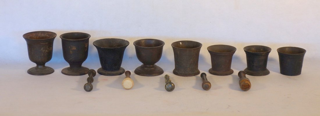 Grouping of 8 early cast iron mortars, including 5 (1 of 3)