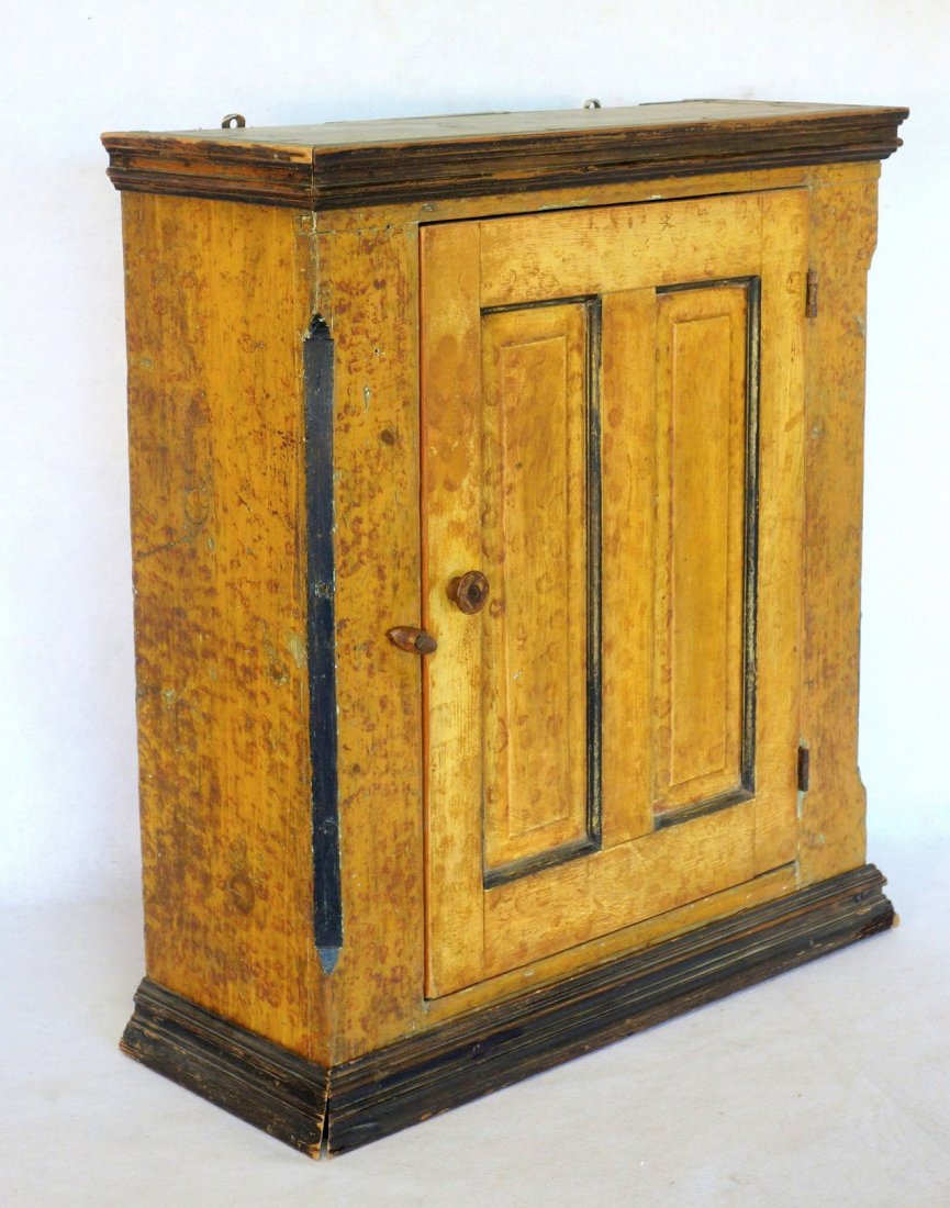Early sponge decorated single door wall cupboard in (1 of 3)