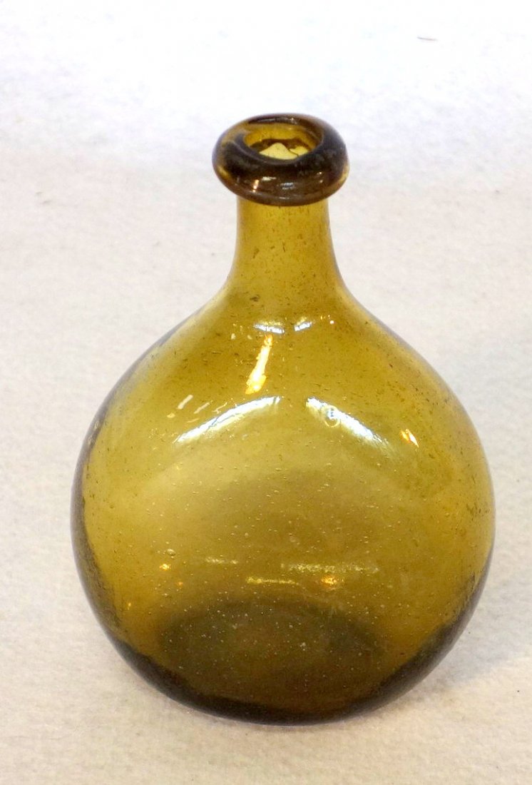 Early amber chestnut flask, with rolled lip, hand (1 of 3)