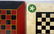 Two game boards including one in black, white and green - 2
