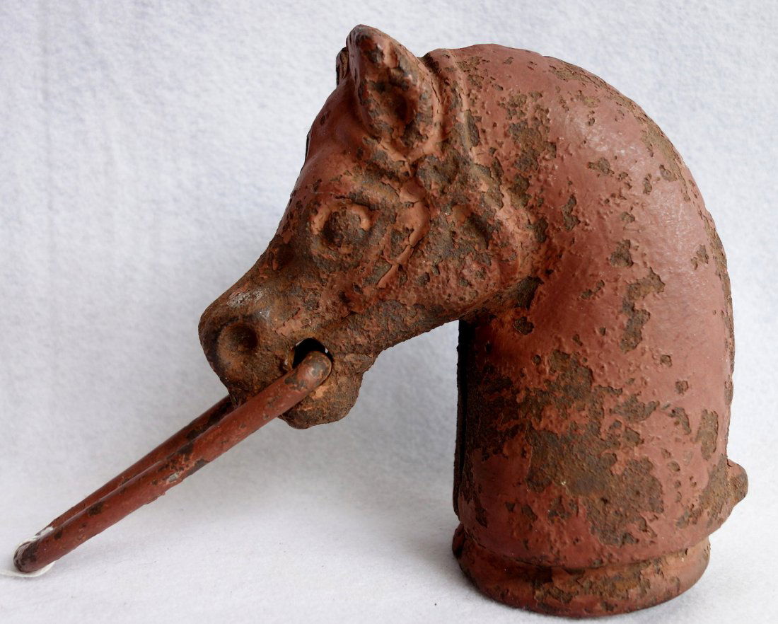 Cast iron horse head hitching post with traces of red (1 of 3)