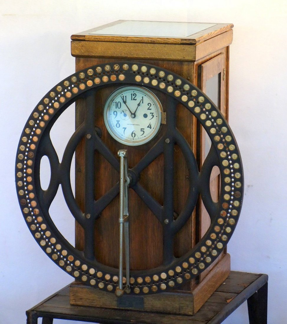 International Time Recording Company clock, one of the: International Time Recording Company clock, one of the early Divisions of IBM, with oak case, and iron time punch wheel. Box size 35.5"H x 16.5"W x 21.5"D. Overall in very good condition but has not b