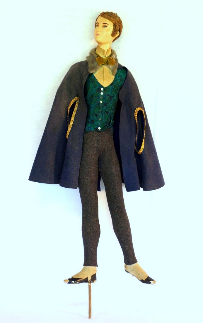 Composition dressed store mannequin (or stage figure): Composition dressed store mannequin (or stage figure) of a gentleman wearing vest and bow tie - hand painted face, original costume, chips to gesso on shoes, missing arms. 37"H. Circa 1950.