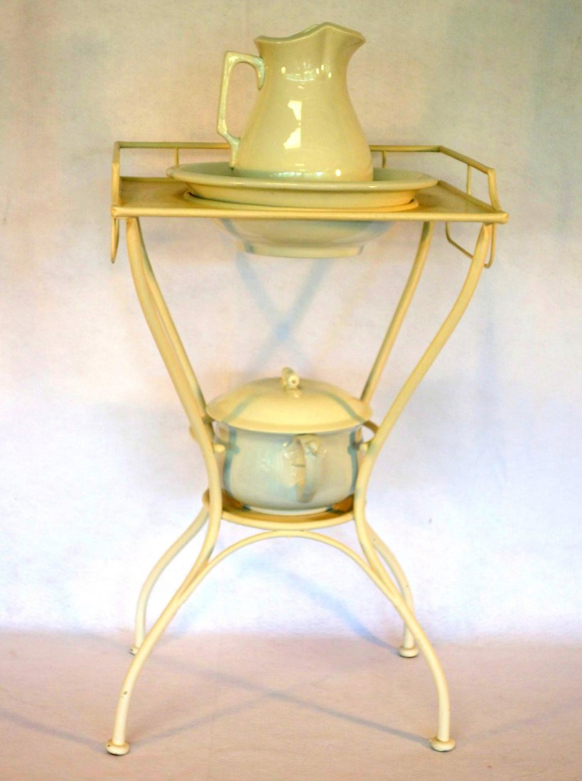 Iron washstand with ironstone bowl, pitcher and non: Iron washstand with ironstone bowl, pitcher and non matching chamber pot. All late 19th century in very good condition.