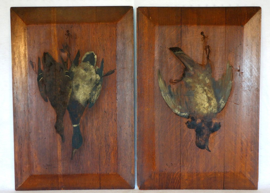 Pair of hanging game bird paintings on oak raised: Pair of hanging game bird paintings on oak raised panels signed C. Braley (Clarence Braley, Mass. 1854 - 1927). Entitled on reverse "Ducks" and "Partridge". Both with slight wear, some surface scratch