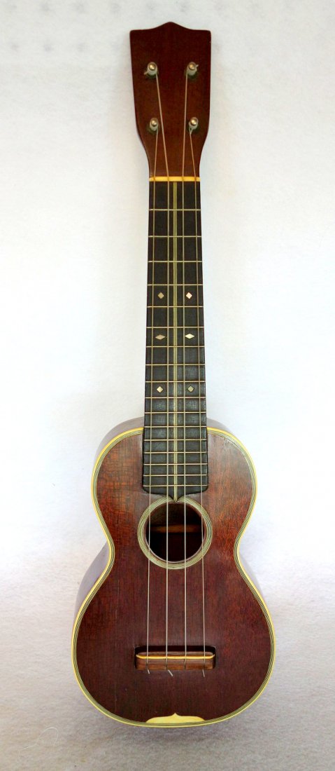 C.F. Martin soprano 3 ukulele, mahogany with diamond: C.F. Martin soprano 3 ukulele, mahogany with diamond inlay on the finger board and celluloid bindings. Stamped behind the head stock and in the body "C. F. Martin & Co. Nazareth P.A." Some hair lines 