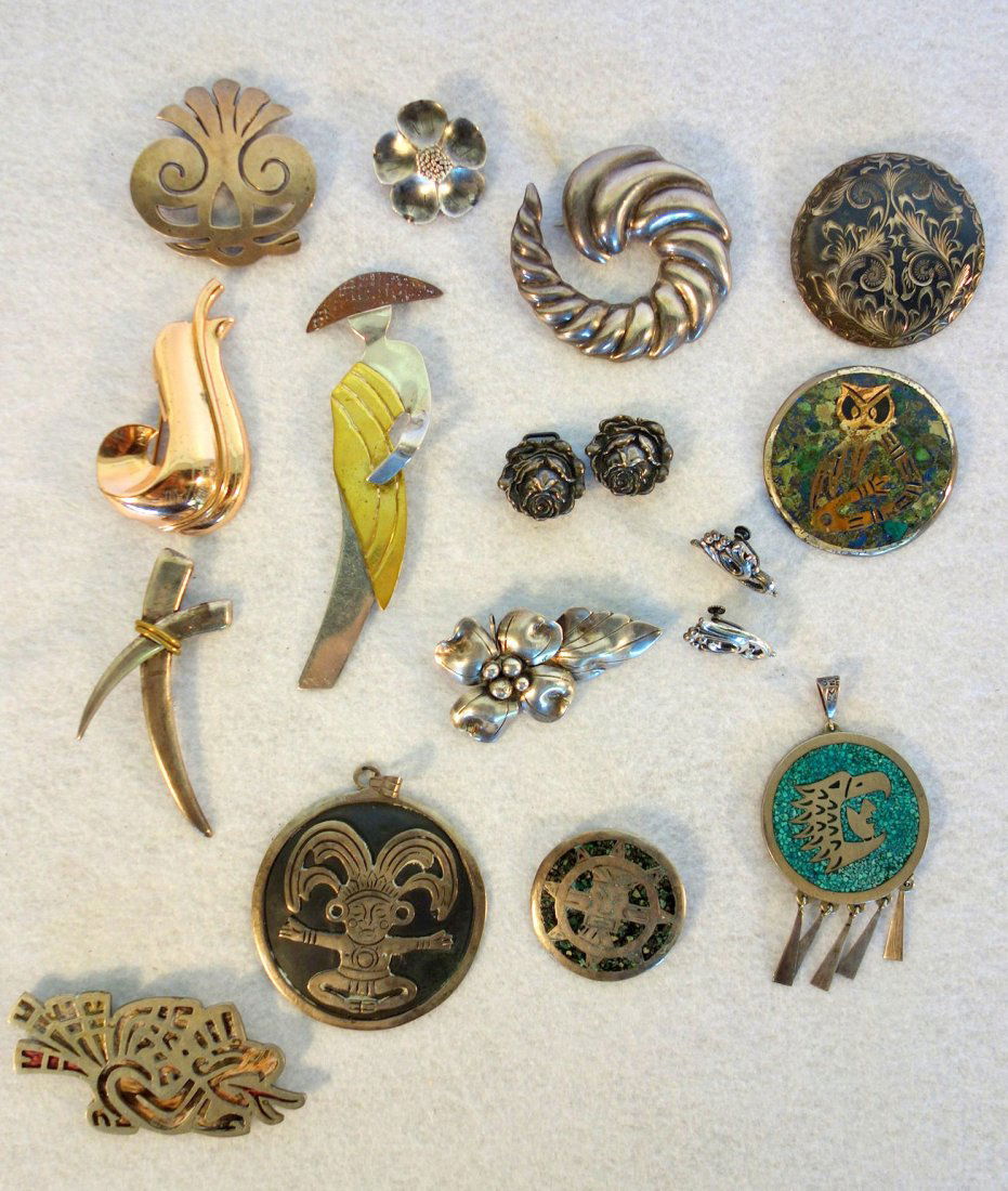 Grouping of 15 pieces of American, Mexican and Native: Grouping of 15 pieces of American, Mexican and Native American Sterling jewelry including Art Deco broach with applied gold robe signed "A", signed Monet broach with gold wash, John Wanamaker floral b