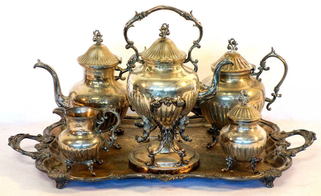 Six piece silver plate tea/coffee service signed B.S.C.: Six piece silver plate tea/coffee service signed B.S.C. (Birmingham Silver Co.) - silver on copper. Set consists of 2 footed tea pots - 10.5"H & 11.5"H, heated coffee pot on swivel stand - 15"H, foote