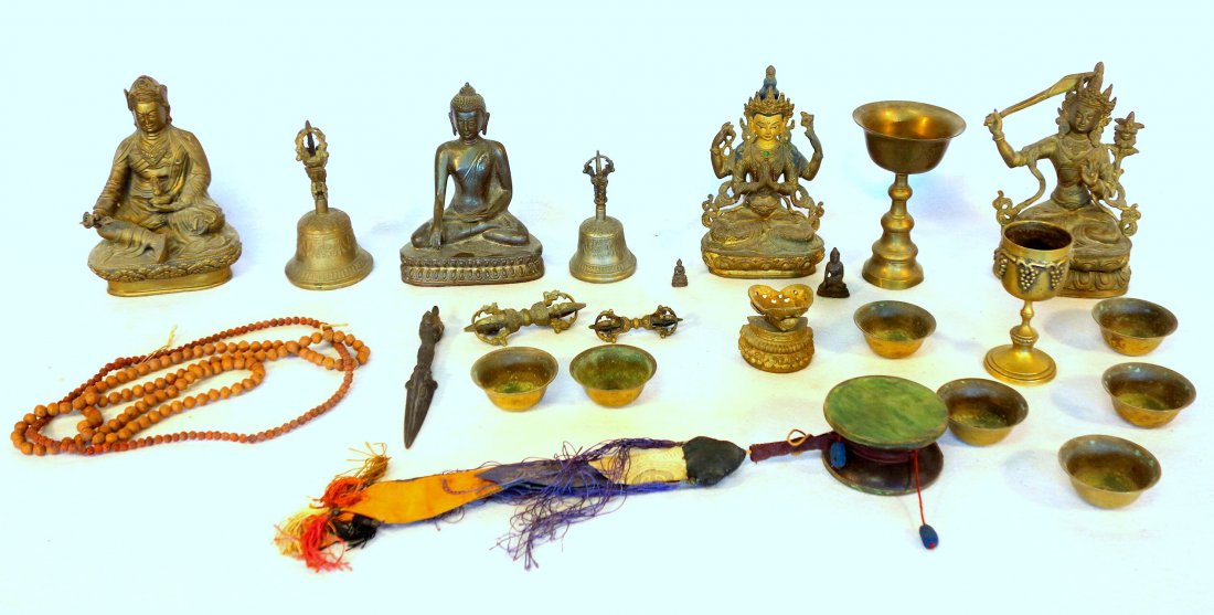 Large grouping of mostly Tibet Buddhism related: Large grouping of mostly Tibet Buddhism related collectibles including 4 bronze statues - each approximately 8.5"H, various brass cups and chalice, 2 ornate metal bells, 2 sets of hand made dried nut/