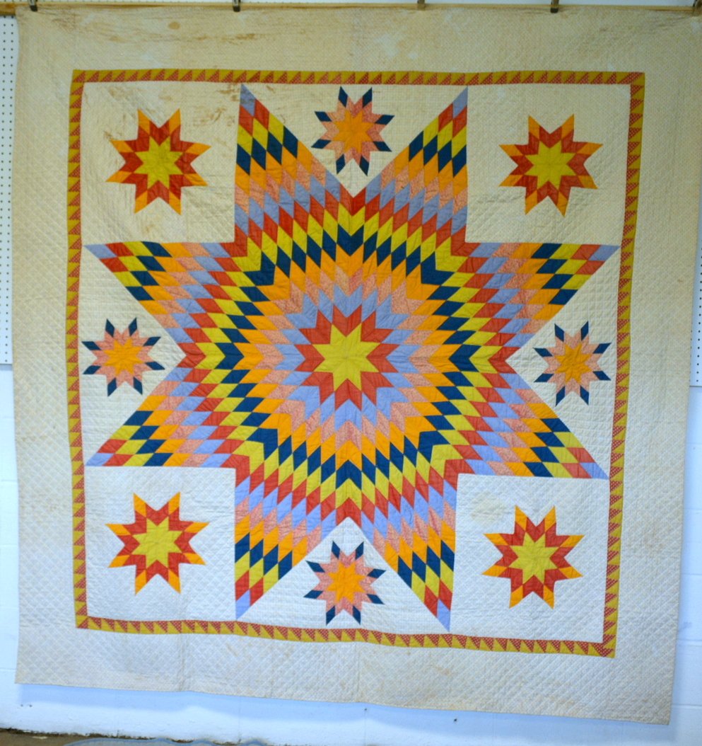 Graphic Lone Star pattern hand sewn quilt - reverse: Graphic Lone Star pattern hand sewn quilt - reverse fabric is pieced in a stripe design - Some staining along base, no fabric damage or repairs, overall good condition - late 19th century. 86" x 82.5"