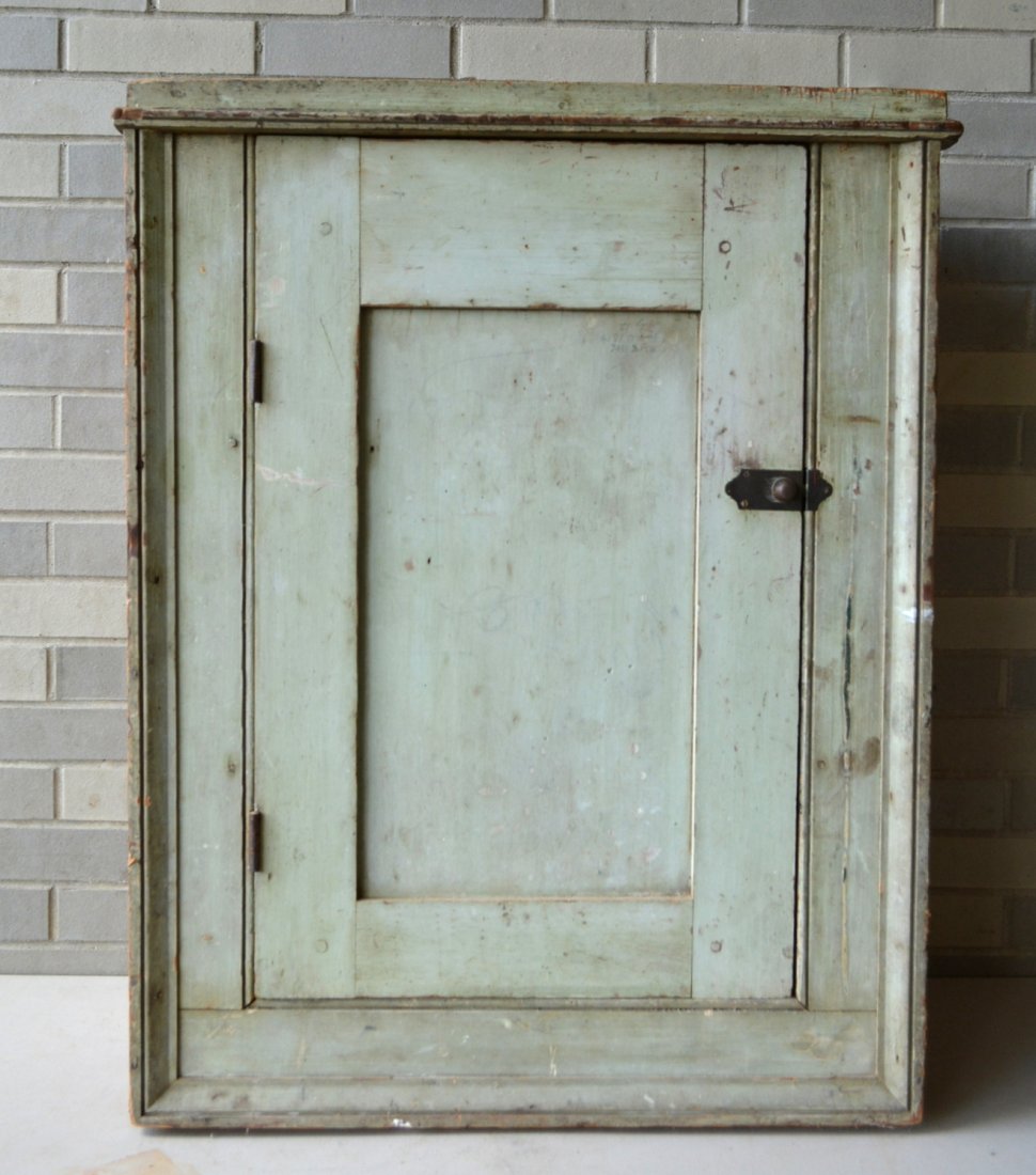 Primitive single door built in wall cupboard in: Primitive single door built in wall cupboard in original gray paint, with picture frame molding - mid 19th century - good condition - 28"W x 14"D x 35 1/4"H.