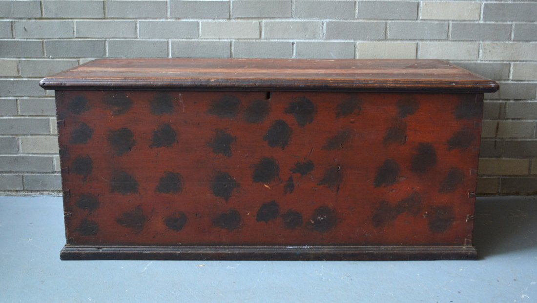 Good blanket box in original red paint with black: Good blanket box in original red paint with black sponge decorated splotches - matching top and base molding all original - early 19th century - old professional repair to top otherwise very good cond