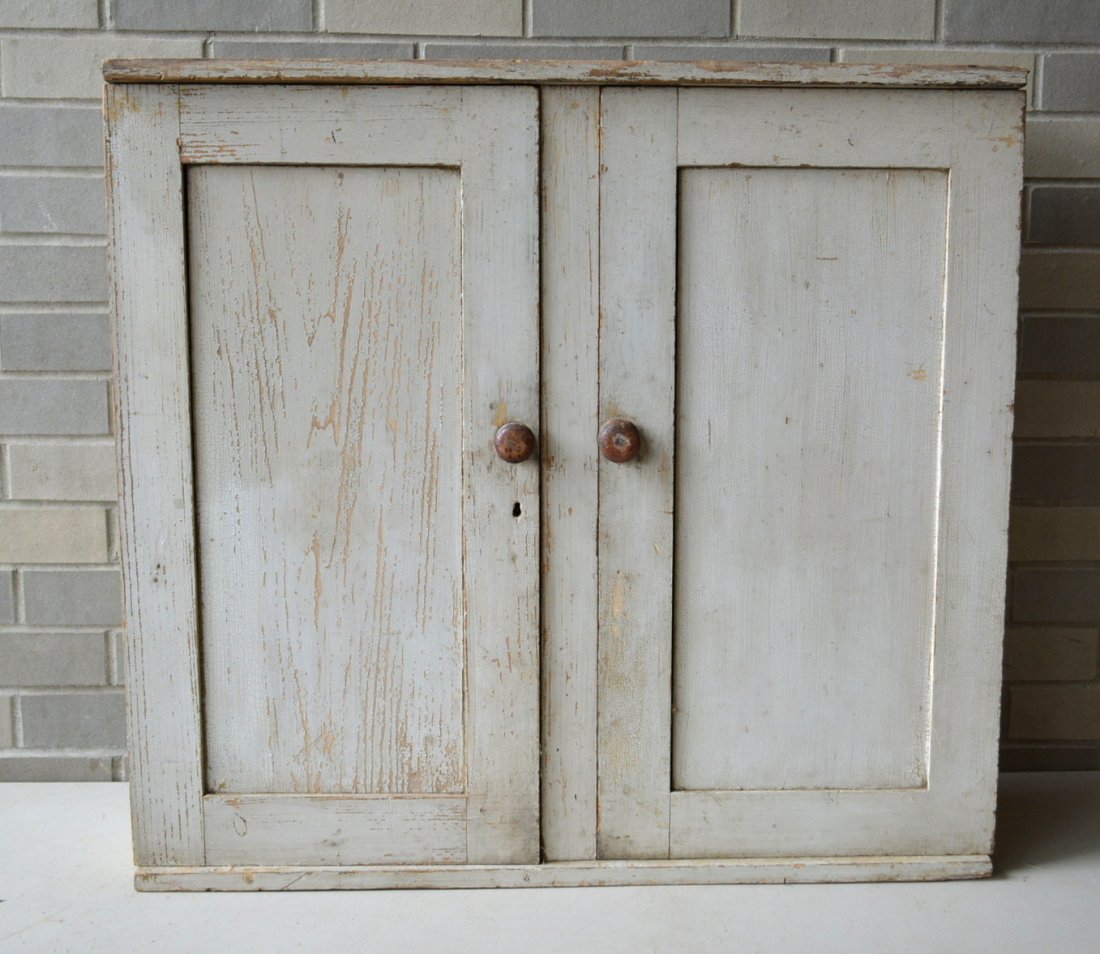 Good 2 door wall cupboard in original white paint - top: Good 2 door wall cupboard in original white paint - top dovetailed into sides - some crazing and wear to paint, but overall very good condition - original wooden pulls and lock - early to mid 19th cen