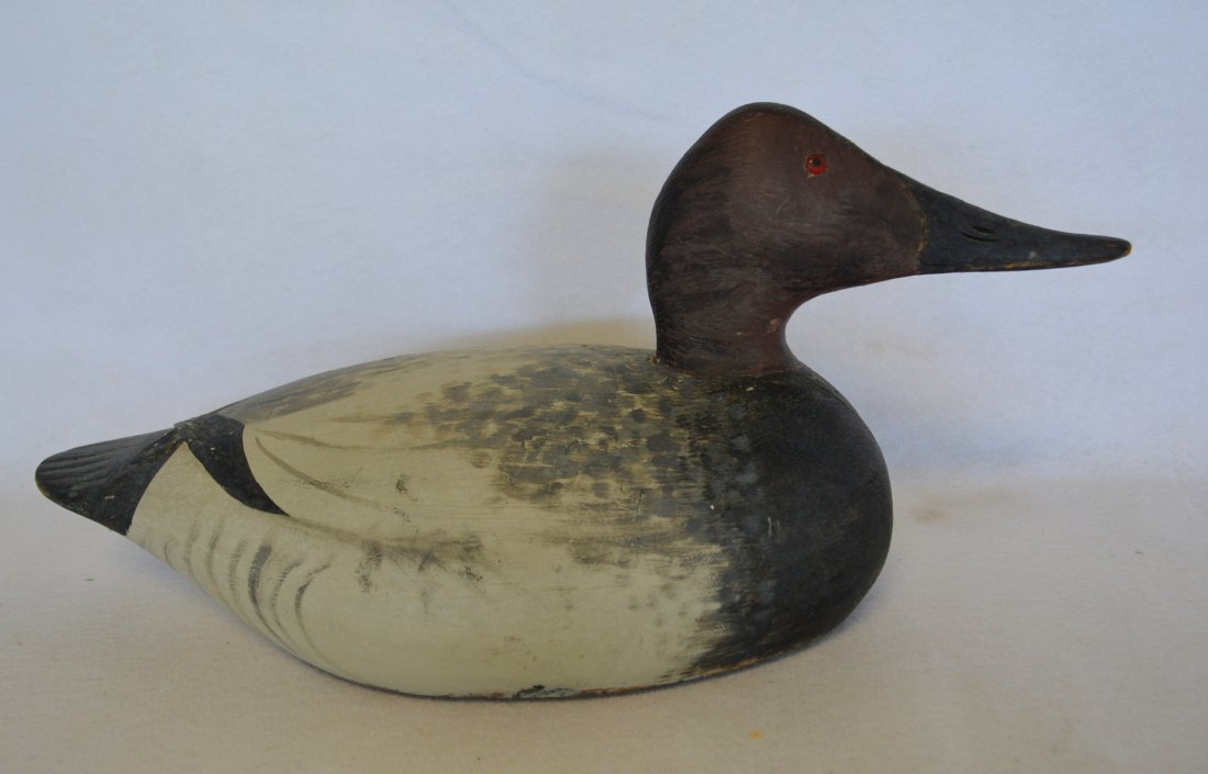 Canvasback decoy by Anthony Elmer Crowell (1862-1952),: Canvasback decoy by Anthony Elmer Crowell (1862-1952), East Harwich, Massachusetts, c. 1905 - oval brand mark on base - "Mackey Collection" stamp also on base - carved crossed tail feathers - older re