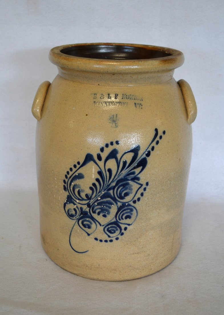 Two stoneware crocks including 4 gal with large blue: Two stoneware crocks including 4 gal with large blue flower signed S.L. Pewtress New Haven, CT - two 3" hairlines and chip on backside otherwise good condition & and a 4 gal. with large blue flower si