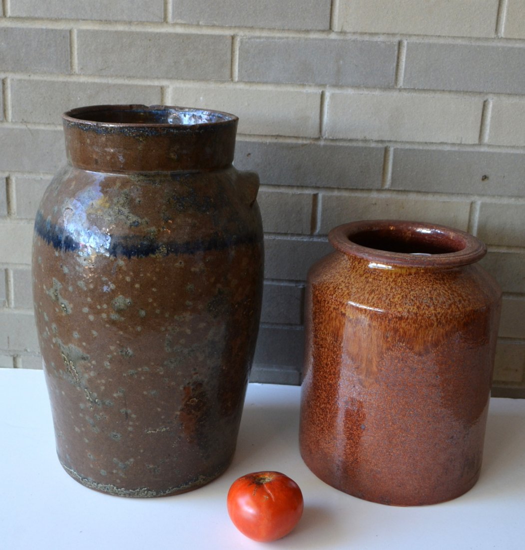 Two redware pots: 1) Large crock with mottled blue and: Two redware pots: 1) Large crock with mottled blue and green glaze and a cobalt blue drip band around perimeter - 19th century - missing one ear and chip to rim, otherwise very good condition. 16"H; 2