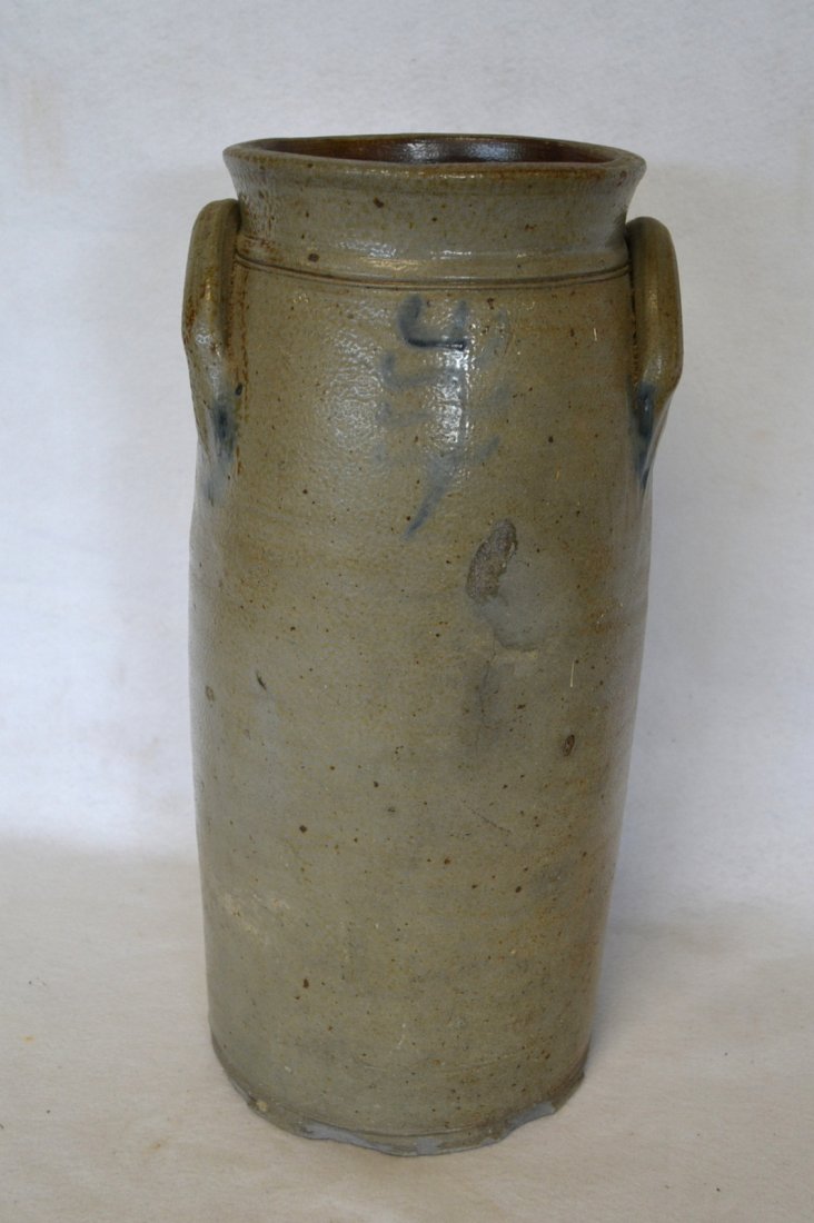 Tall stoneware crock decorated with a cobalt blue: Tall stoneware crock decorated with a cobalt blue tree-like design on front and back - incised lines around the slightly tapered collar - the decorations on both side are very faint - extensive chips 