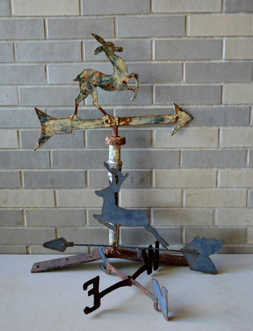Two silhouette iron and tin deer weathervanes. The: Two silhouette iron and tin deer weathervanes. The first made from sheet iron with a pipe pedestal attached to original iron roof mount - 19"L x 27" overall height - Good condition - Early to mid 20th
