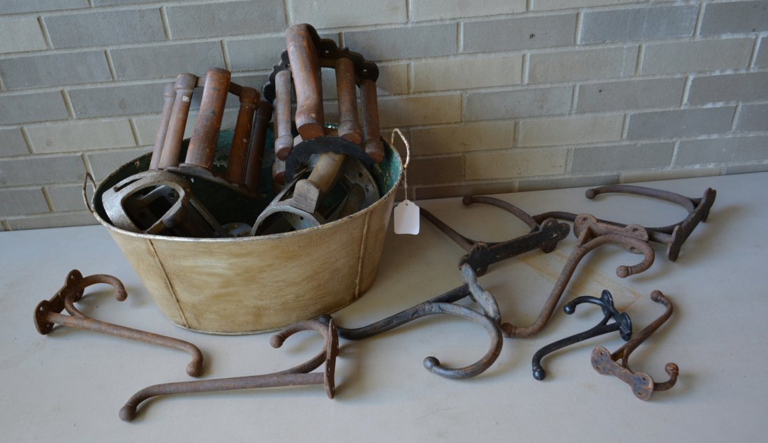 Grouping of horse related hardware including 5 cast: Grouping of horse related hardware including 5 cast iron & wood horse harness holders - 2 complete in very good condition signed illegibly possible JW. Fiske NY - the other 3 with loose section of orn