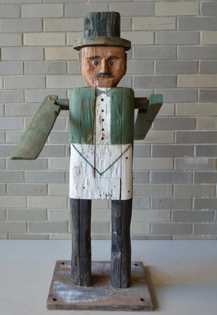 Large folk art custom made wooden whirligig in the form: Large folk art custom made wooden whirligig in the form of a man wearing tux with green jacket and top hat - mid to late 20th century - 39"H x 17"W. Original paint. Very good condition. Signed and num