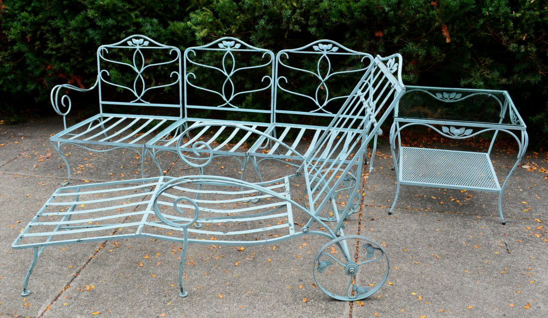 Three piece signed Salterini iron patio set consisting: Three piece signed Salterini iron patio set consisting of a 3 piece sectional sofa/love seat, end table with glass top, and a lounge. NO Cushions. Very good original condition.