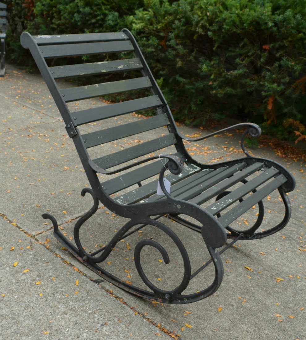 Porch rocker with wooden slates and cast iron frame and: Porch rocker with wooden slates and cast iron frame and cast iron rockers - mid to late 20th century - good condition.