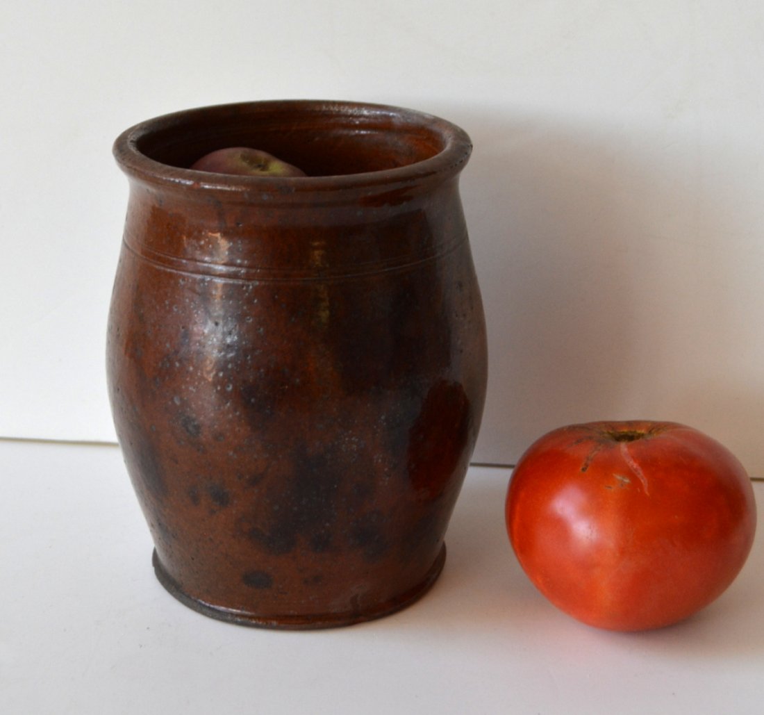 Small redware jar with manganese decoration - 6"H. One: Small redware jar with manganese decoration - 6"H. One tiny chip on base of rim, otherwise very good condition.