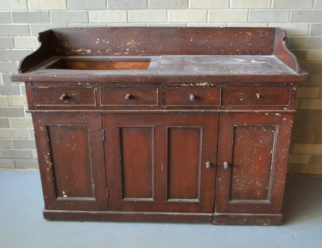 Primitive copper lined dry sink having 2 false drawers: Primitive copper lined dry sink having 2 false drawers adjacent to 2 real drawers over 2 doors - 19th century - layers of old paint, missing one pull, but overall in good condition. 49.5"L x 19"D x 35