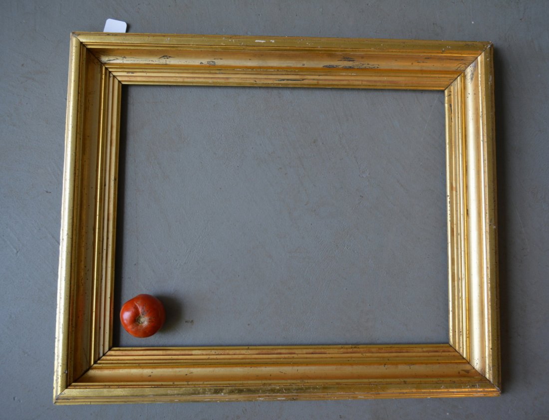 Large 19th century lemon gold frame - opening size: Large 19th century lemon gold frame - opening size 25.5" x 20.5" - overall size 27.5" x 32.5". Some gold losses to the outer perimeter of frame, otherwise very good original condition.