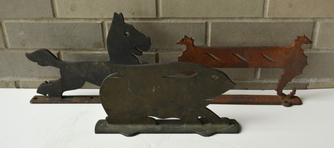 Three cast iron figural boot scrapers including rabbit,: Three cast iron figural boot scrapers including rabbit, seahorse and stylized horse or dog - each approximately 10" to 11". All in good condition.