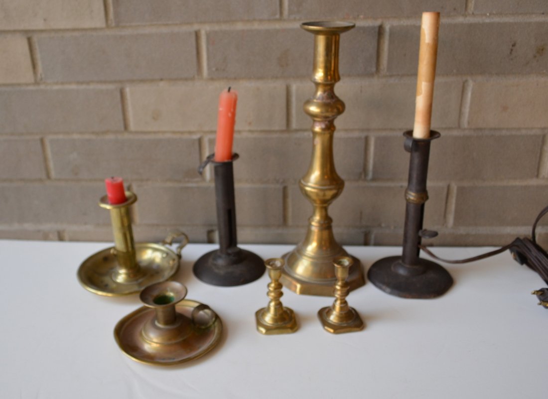Grouping of candle lighting devices including 2 hog: Grouping of candle lighting devices including 2 hog scrapper candlesticks (one with wedding band has been electrified0, 2 early miniature brass candlesticks 3"H, late 18th century chamber stick, etc.