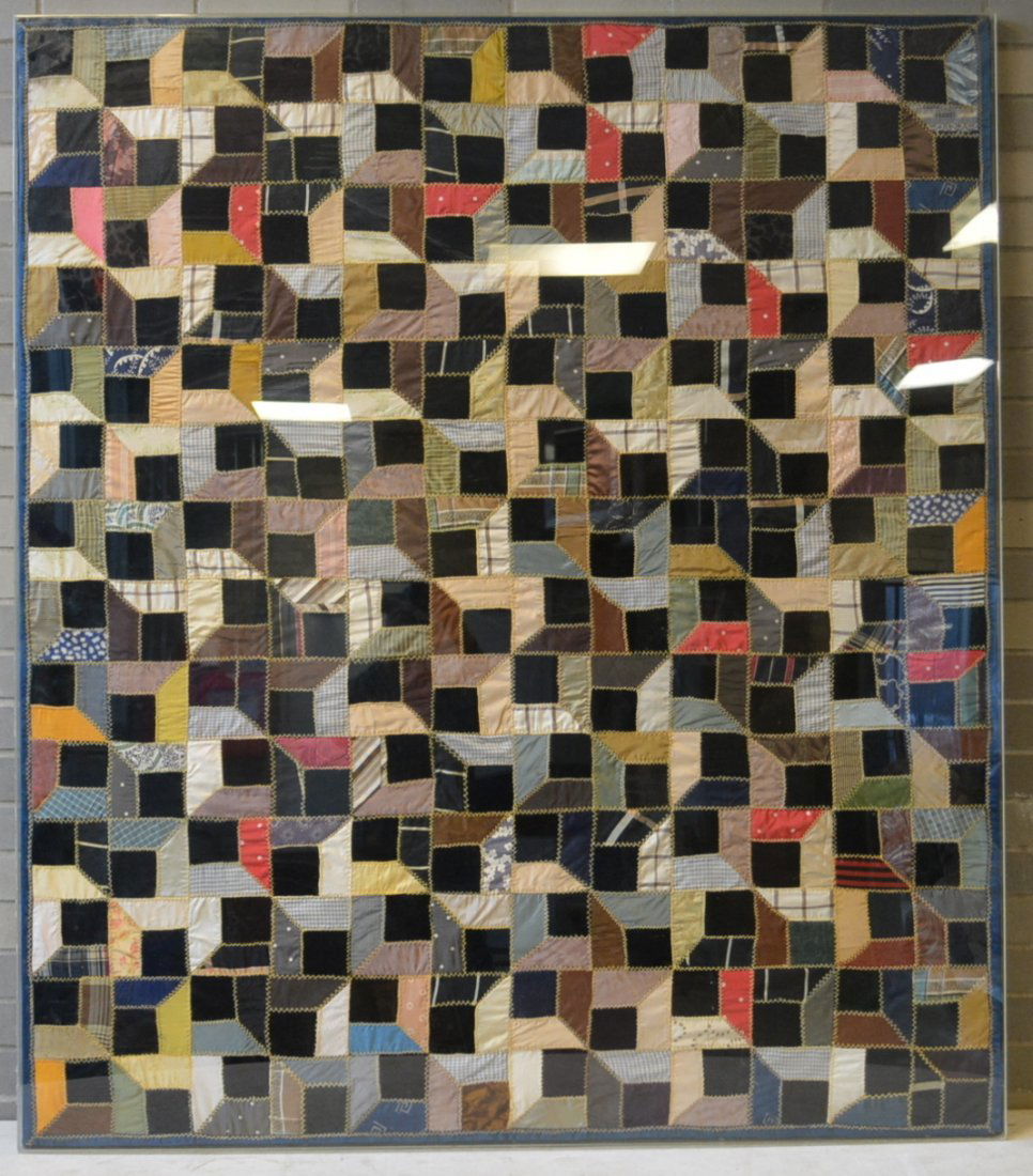 Mounted crazy quilt displayed behind a special plastic (1 of 5)
