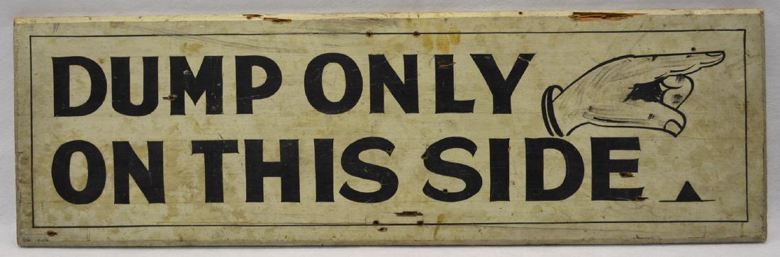 Old wooden sign with finger of hand pointing to the (1 of 3)