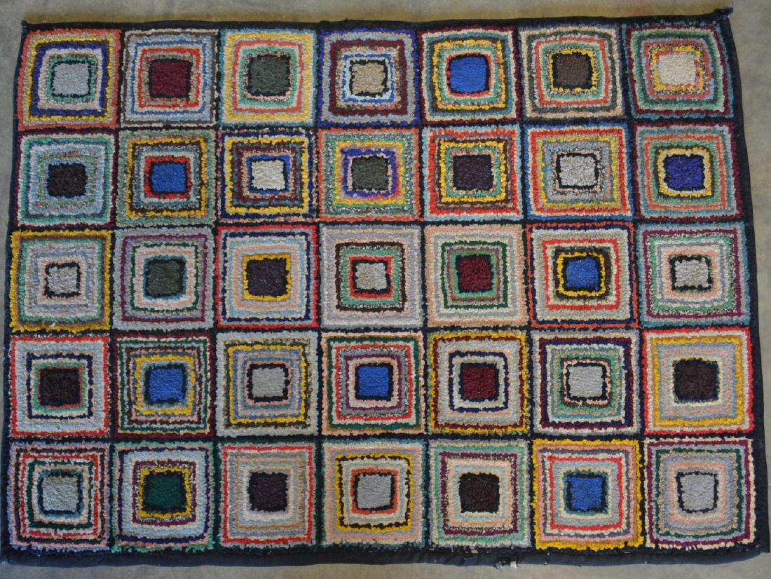 Colorful hooked rug decorated with 35 squares, each (1 of 3)