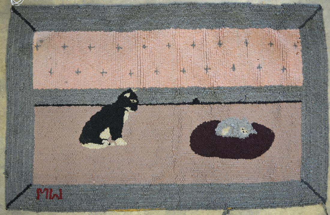 Hooked rug depicting a sitting cat looking down on a (1 of 4)