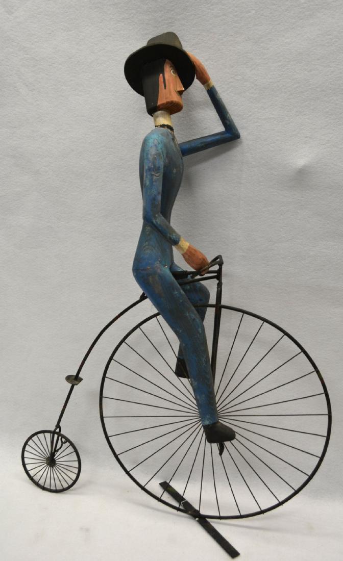 Folk art carving of a man wearing suit and a top hat (1 of 5)